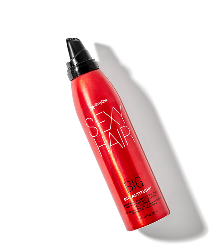 Big Altitude red mousse bottle with spray nozzle on white background