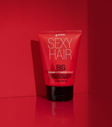 Big Creme 2 Powder Play tube on red background with textured cap