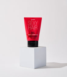 Big Creme 2 Powder Play tube displayed on white pedestal