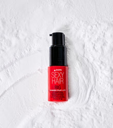 Big Powder Play Lite pump bottle on white textured background