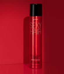 Big Spray & Stay intense hold hairspray on red background