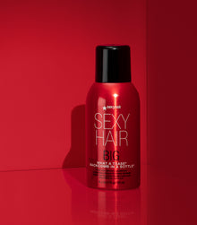 Big What a Tease firm volumizing hairspray on red background
