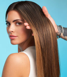 Model showing shiny, glossy honey-blonde hair after using Healthy SexyHair Gloss N' Glow