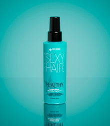 Healthy SexyHair Shine Show Blowout Spray bottle on teal background