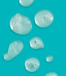 I Want SexyHair Moisture shampoo gel texture drops on turquoise background