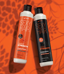 I Want SexyHair Strength shampoo and conditioner bottles on orange background