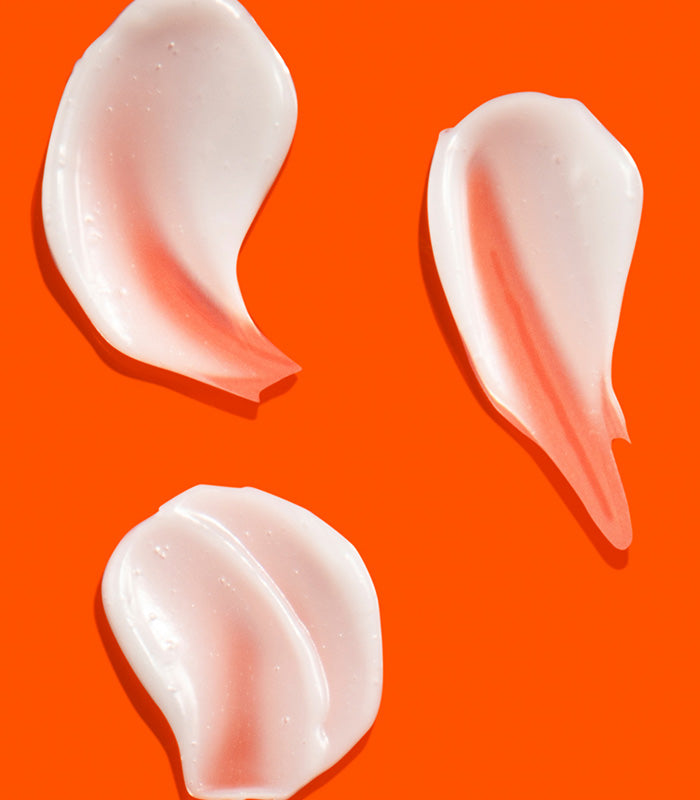 I Want SexyHair Strength creamy conditioner texture swatches on orange background