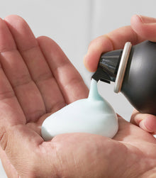 Style SexyHair Blow It Up volumizing gel foam being dispensed from spray bottle nozzle
