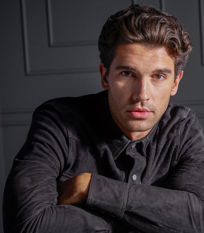 Male model with slicked back controlled styled hair created with Control Maniac wax
