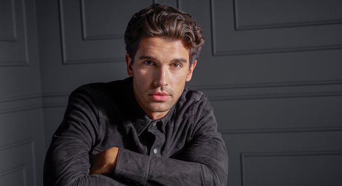 Male model with defined curled hairstyle created using Curl Power mousse product