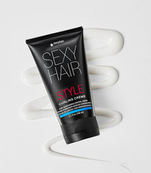 Multiple Style SexyHair curl styling products arranged on light neutral background