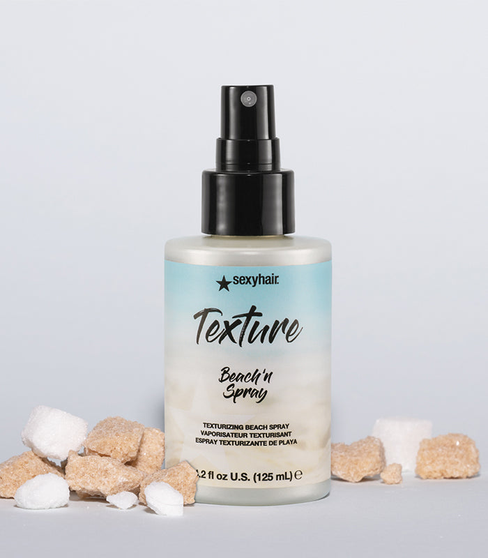 Texture SexyHair Beach'n Spray bottle with sand and shells on gradient teal background