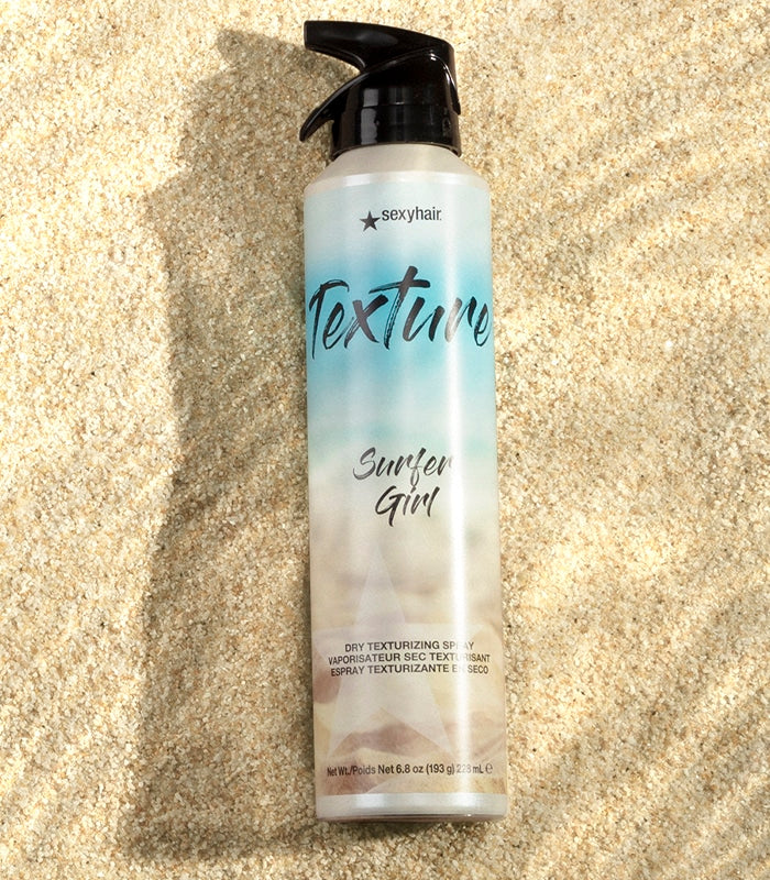 Texture SexyHair Surfer Girl spray bottle on sandy background